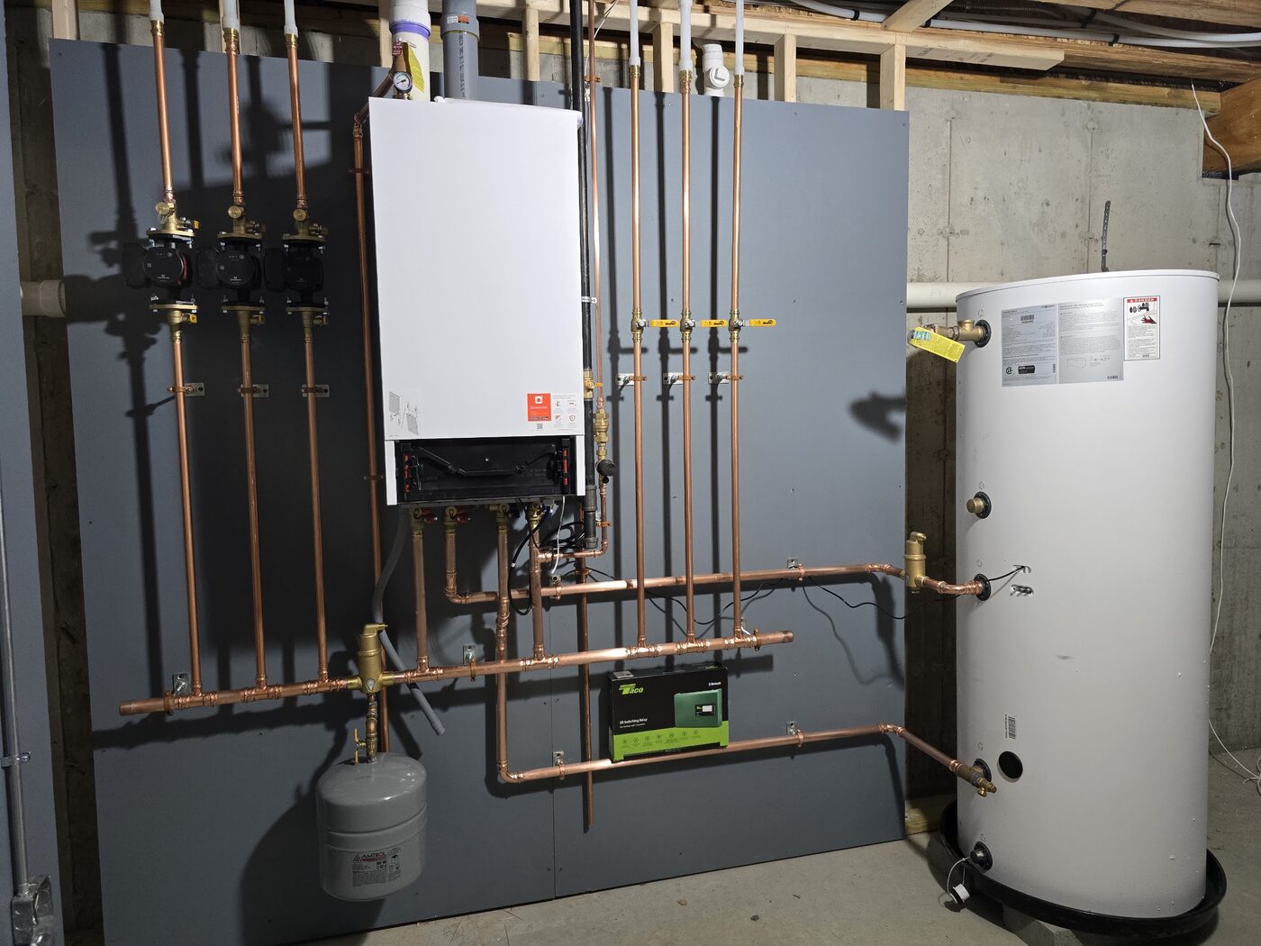 Wall-hung condensing boiler and indirect water heater with gas piping and shutoff valves